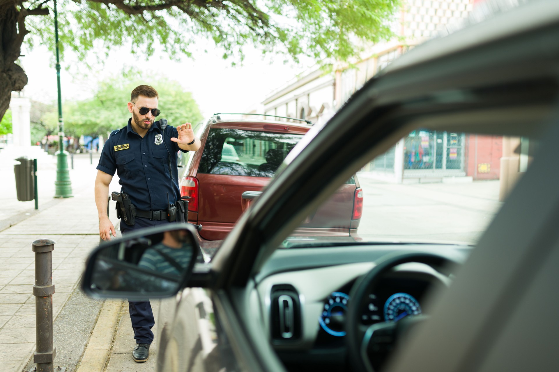 Angry police officer stopping a bad driver